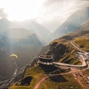 Photo by Jairph person paragliding on mountain cliff during daytime