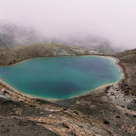lake in the middle of mountain