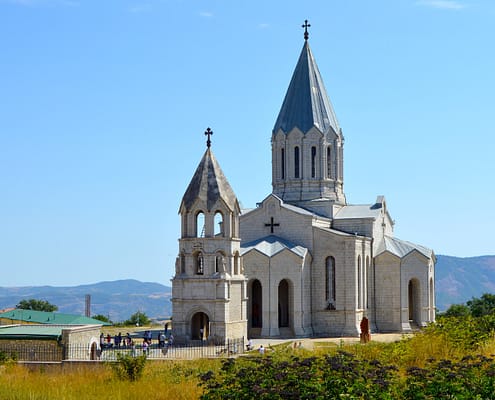 gray and white concrete church under blue sky during daytime