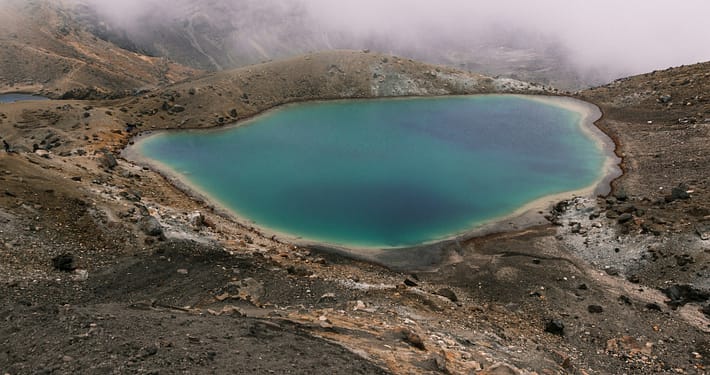 lake in the middle of mountain