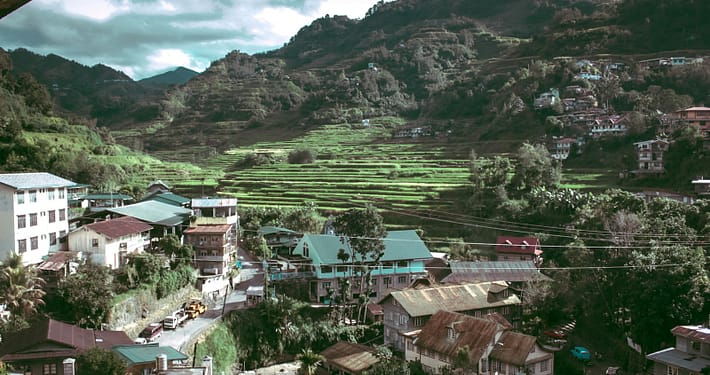 aerial photo of houses near hill