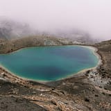 lake in the middle of mountain